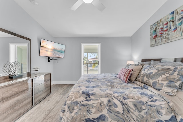 bedroom with wood finished floors, baseboards, a ceiling fan, and vaulted ceiling