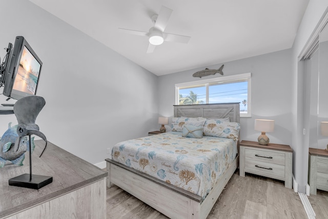 bedroom featuring light wood-style flooring and a ceiling fan