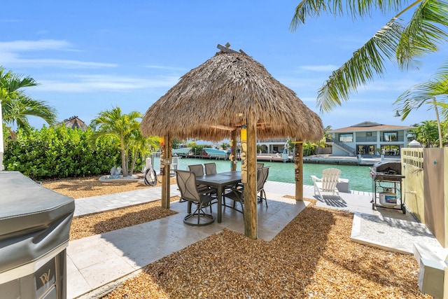 view of patio featuring a grill and outdoor dining area