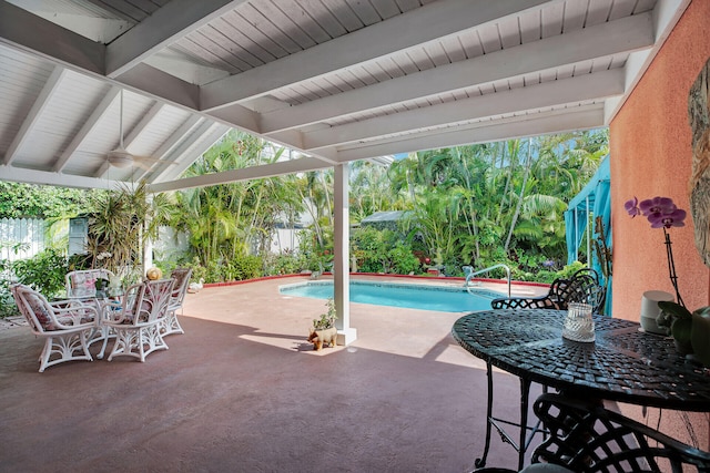 view of swimming pool with a patio and ceiling fan