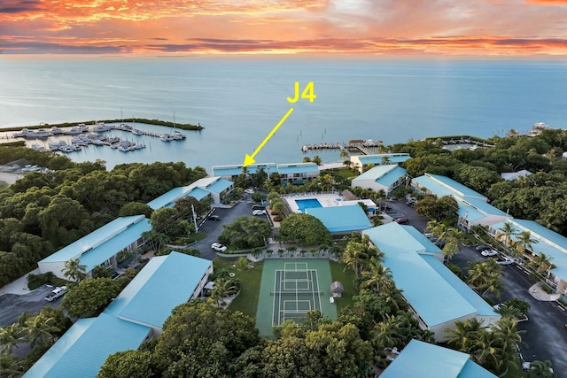 aerial view at dusk with a water view