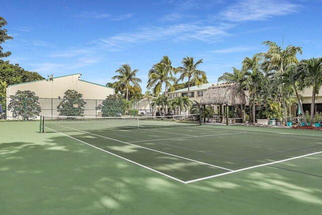 view of sport court with fence