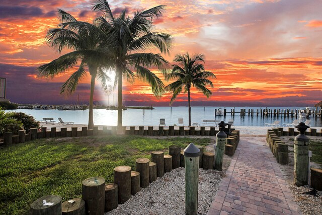 exterior space with a water view and a yard