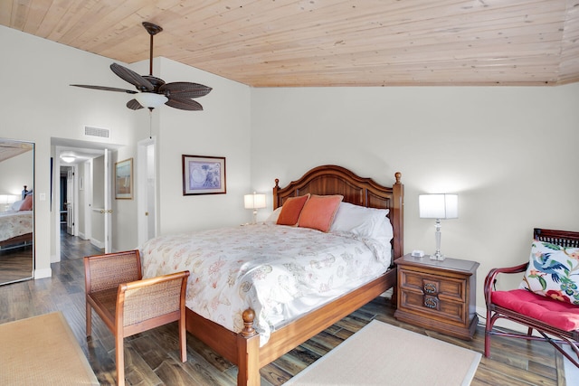 bedroom with lofted ceiling, wood ceiling, dark wood-type flooring, and ceiling fan