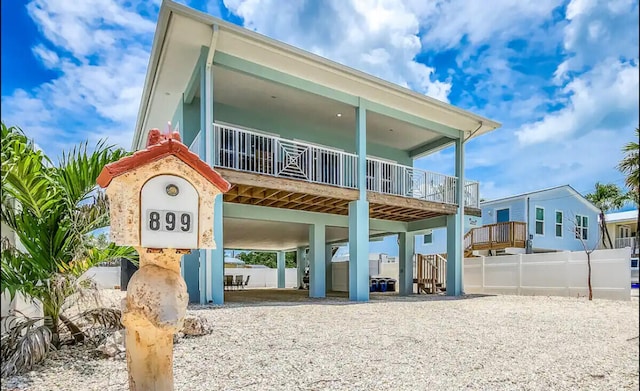 rear view of house featuring a carport