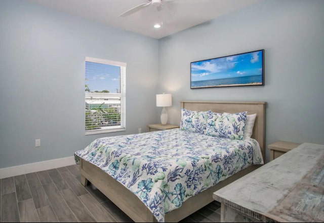 bedroom featuring dark hardwood / wood-style floors and ceiling fan