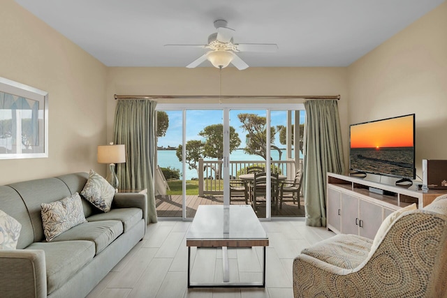 living area featuring a ceiling fan