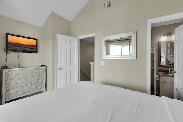 bedroom featuring visible vents and vaulted ceiling