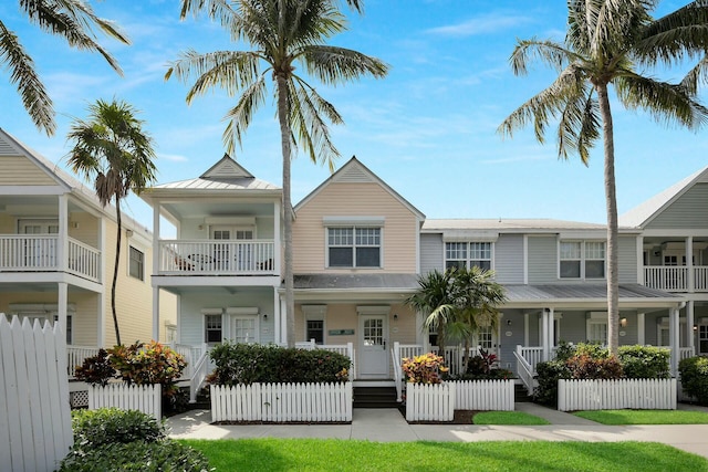 view of front of house with a fenced front yard and metal roof