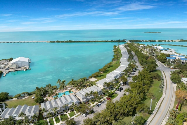 drone / aerial view featuring a water view and a residential view