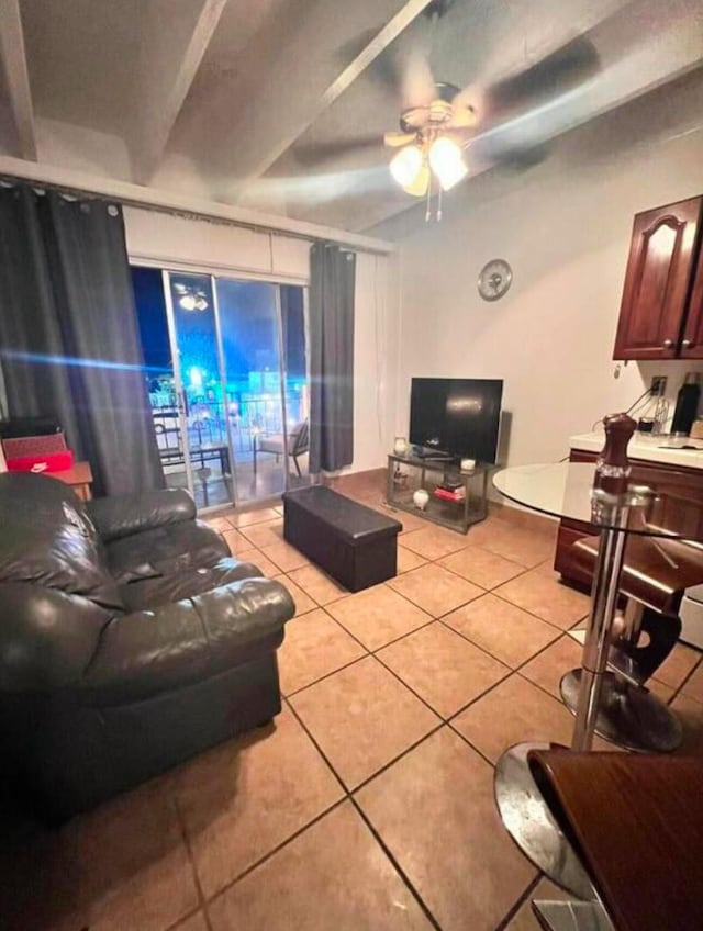 living room featuring light tile patterned flooring and ceiling fan