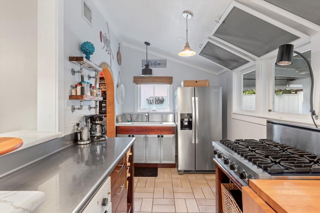 626 Margaret St, Key West, FL 33040 - kitchen featuring pendant lighting, sink, stainless steel counters, stainless steel appliances, and vaulted ceiling