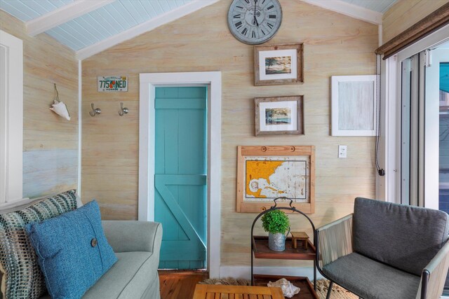 626 Margaret St, Key West, FL 33040 - sitting room featuring hardwood / wood-style flooring, vaulted ceiling with beams, and wood walls