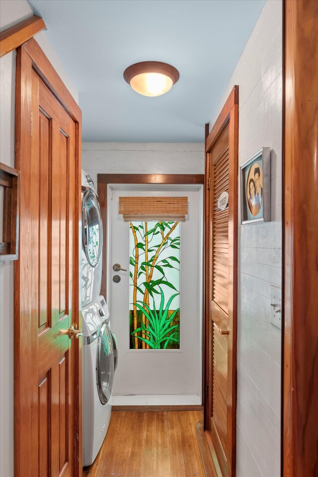 626 Margaret St, Key West, FL 33040 - laundry room with stacked washer and dryer and light hardwood / wood-style floors