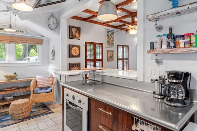 626 Margaret St, Key West, FL 33040 - kitchen with stainless steel counters, ceiling fan, coffered ceiling, oven, and beamed ceiling