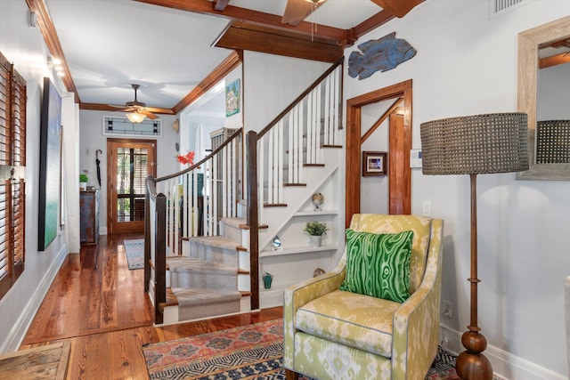 626 Margaret St, Key West, FL 33040 - stairway featuring crown molding, hardwood / wood-style floors, built in features, and ceiling fan
