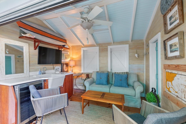 626 Margaret St, Key West, FL 33040 - living room featuring lofted ceiling with beams, wood-type flooring, sink, wine cooler, and ceiling fan