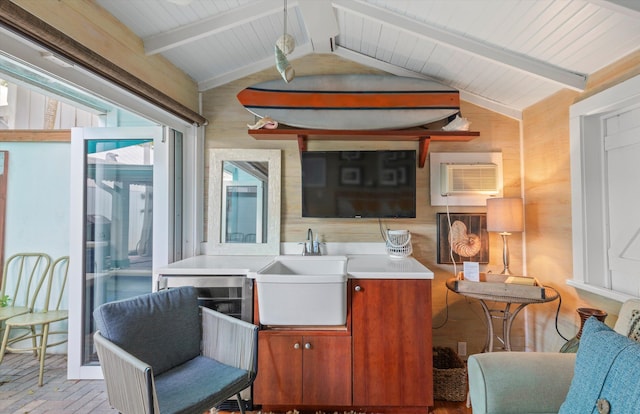 626 Margaret St, Key West, FL 33040 - interior space featuring wooden walls, a wall mounted air conditioner, sink, and lofted ceiling with beams