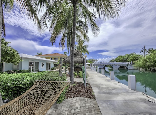 dock area with a water view and a gazebo