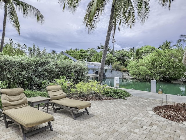 view of patio featuring a water view