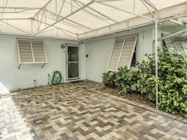 view of patio / terrace featuring a lanai