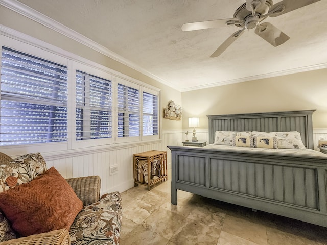 bedroom featuring crown molding and ceiling fan