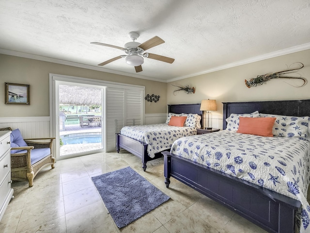 tiled bedroom with ornamental molding, access to outside, ceiling fan, and a textured ceiling