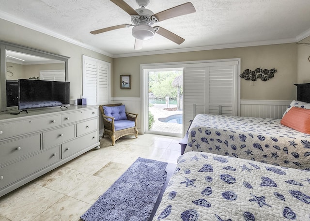 bedroom featuring ceiling fan, crown molding, access to outside, and a textured ceiling