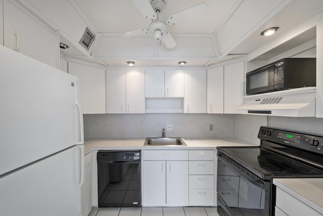 2000 Coco Plum Dr Unit 106, Marathon, FL 33050 - kitchen with black appliances, under cabinet range hood, white cabinets, light countertops, and open shelves