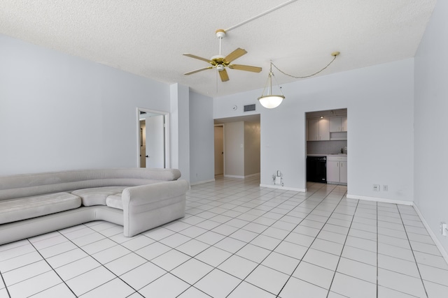 2000 Coco Plum Dr Unit 106, Marathon, FL 33050 - living area featuring a textured ceiling, a ceiling fan, and light tile patterned floors