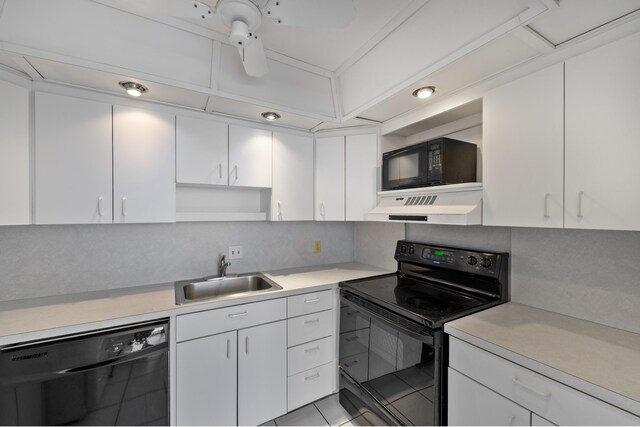 2000 Coco Plum Dr Unit 106, Marathon, FL 33050 - kitchen featuring black appliances, custom range hood, and light countertops