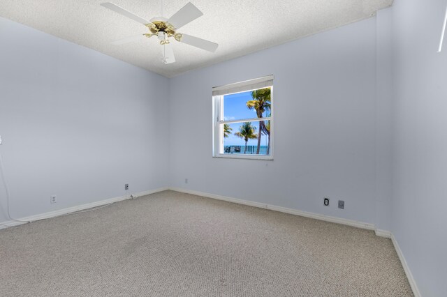 2000 Coco Plum Dr Unit 106, Marathon, FL 33050 - empty room with carpet, a textured ceiling, and a ceiling fan
