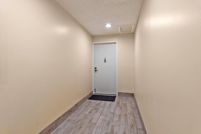 2000 Coco Plum Dr Unit 106, Marathon, FL 33050 - entryway featuring light wood-style floors, a textured ceiling, and recessed lighting