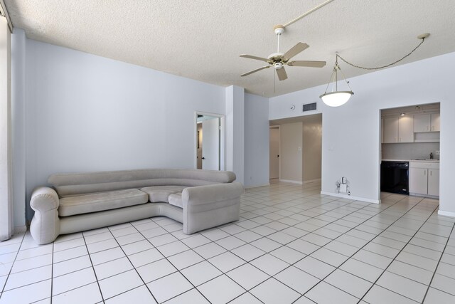 2000 Coco Plum Dr Unit 106, Marathon, FL 33050 - living room with a textured ceiling, ceiling fan, and light tile patterned floors