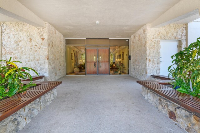 2000 Coco Plum Dr Unit 106, Marathon, FL 33050 - doorway to property featuring stucco siding