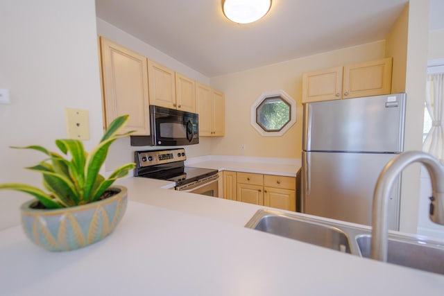 4 Kingfisher Ln, Key West, FL 33040 - kitchen with appliances with stainless steel finishes, light brown cabinets, and light countertops