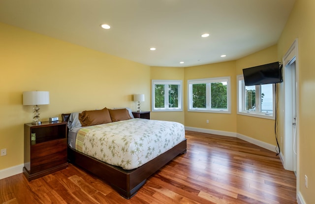 bedroom with hardwood / wood-style flooring