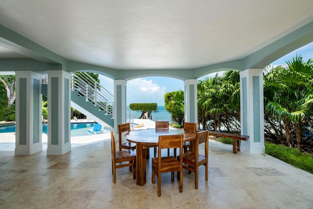 dining room featuring a water view