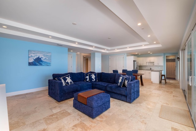 living room with a raised ceiling