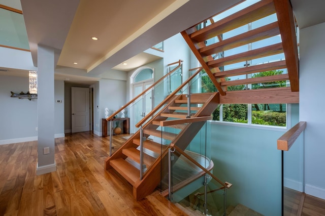 stairway featuring wood-type flooring