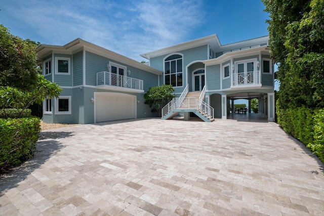 view of front of house with a garage and a carport