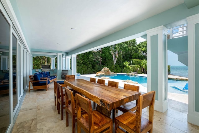 view of patio / terrace with a water view and area for grilling