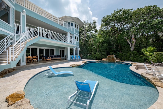 view of swimming pool with a patio area