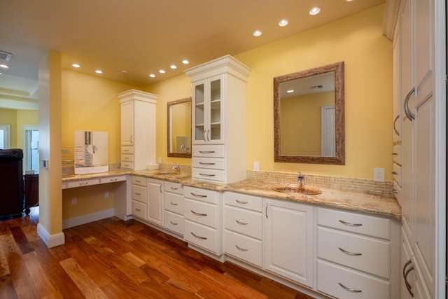 bathroom featuring hardwood / wood-style flooring and vanity