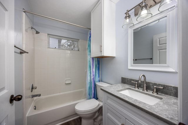 bathroom with toilet, shower / tub combo, and vanity