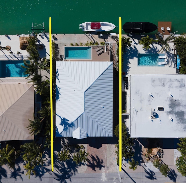 birds eye view of property featuring a water view