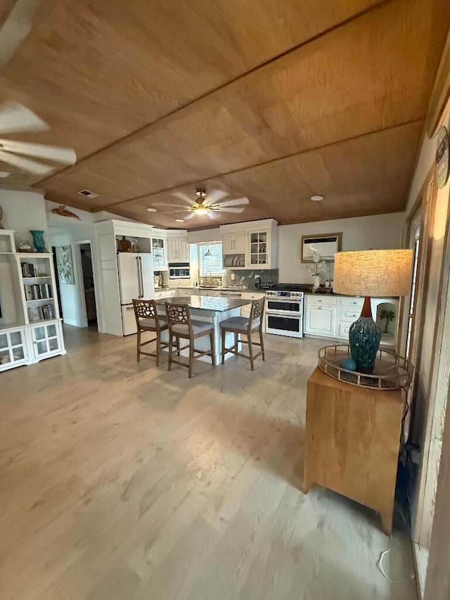 1672 Pandorea Ln, Big Pine, FL 33043 - dining area with wood ceiling, a ceiling fan, and light wood finished floors