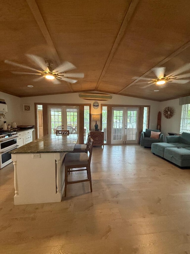 1672 Pandorea Ln, Big Pine, FL 33043 - kitchen with a ceiling fan, french doors, double oven range, and wooden ceiling