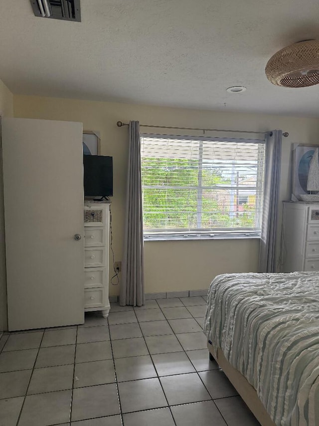 1672 Pandorea Ln, Big Pine, FL 33043 - bedroom with light tile patterned floors