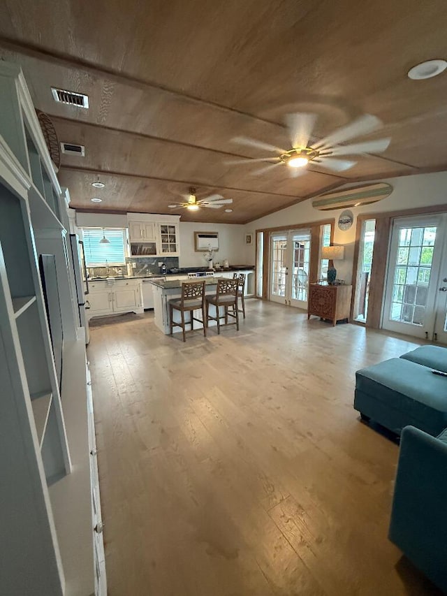 1672 Pandorea Ln, Big Pine, FL 33043 - dining space featuring a ceiling fan, light wood-style flooring, vaulted ceiling, and wooden ceiling